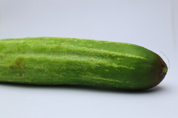Fresh and Vibrant Cucumber on a White Background Close-Up View