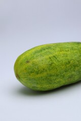 Close-up of Fresh Cucumber on a White Background, Ready for Culinary Use