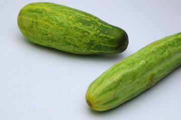 Fresh Organic Cucumbers Displayed on a Clean White Background Surface