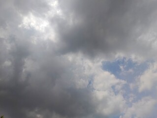 Dramatic Sky with Overcast Clouds and Glimmers of Sunlight breaking through