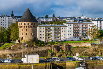Fototapeta premium A view across the river Penfeld towards the Tanguy tower at Brest, France on a sunny day in autumn