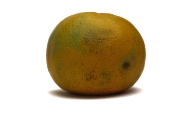 Close-up of a Tangerine with Slight Imperfections Isolated on White Background