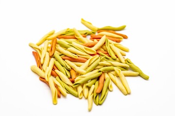Colorful dried pasta on white background