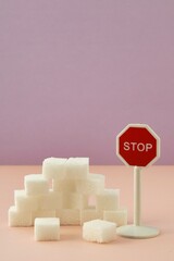 Sugar; Diabetes; No more sugar; Stop using so much sugar; Too much sugar; Sugar cubes with a stop sign