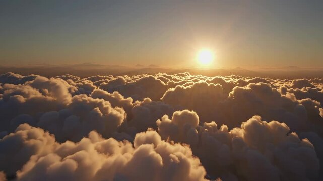 Gorgeous sunset above the clouds in the sky. Sunrays breaking through the clouds. amera rises above the clouds to see the bright sunset sky and the sun