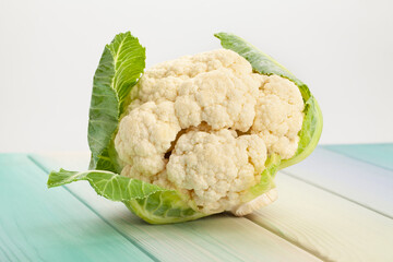 cauliflower on blue wood background