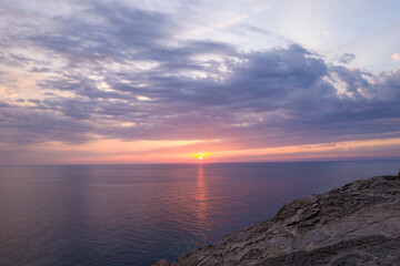 The cliffs of Stintino at sunset in Europe, Italy, Sardinia, Stintino, in summer, on a sunny day.