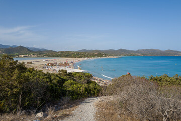The path to Spiaggia di Porto Giunco in Europe, Italy, Sardinia, Cala Caterina, in summer, on a sunny day.