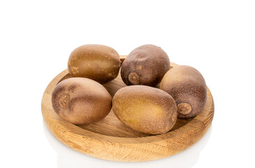 Five kiwis on a wooden tray isolated on white background, close-up.