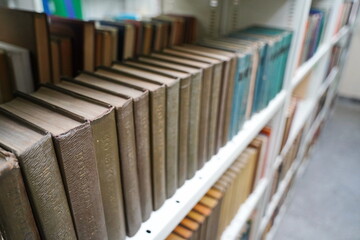 Almaty, Kazakhstan - 02.05.2025 : A shelf with old Soviet books. The City Archive.