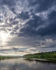 Cloudy sky with a river in the background