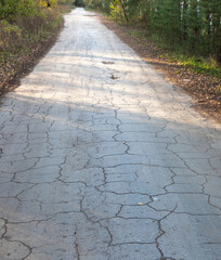 Road with cracks and potholes