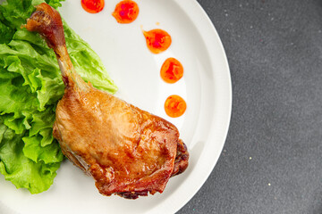 Duck leg confit baked bird meat fresh tasty food dish delicious gourmet food background on the table rustic food top view copy space