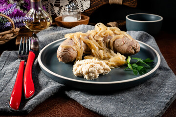 Fried white sausage with onions.