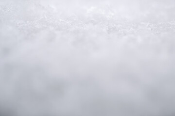close-up photograph of a snow texture, individual flakes are visible, macro photography taken from different angles and differentiated focus