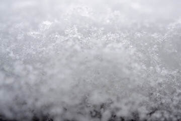close-up photograph of a snow texture, individual flakes are visible, macro photography taken from different angles and differentiated focus