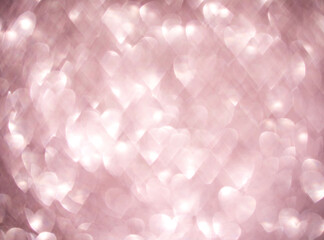 Soft pink glowing heart-shaped bokeh lights with a romantic dreamy ambiance