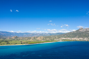 Fototapeta premium The coast seen from the sea in Lotzorai in Europe, Italy, Sardinia, Lotzorai, in summer, on a sunny day.