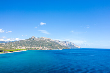 The cliffs by the sea in Lotzorai in Europe, Italy, Sardinia, Lotzorai, in summer, on a sunny day.