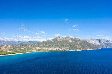 Fototapeta premium The cliffs by the sea in Lotzorai in Europe, Italy, Sardinia, Lotzorai, in summer, on a sunny day.