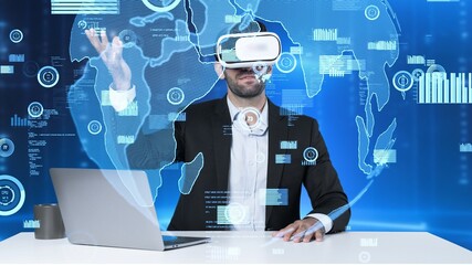 Smart project manager sharing marketing idea while sitting at table with laptop while wearing virtual reality glasses. Skilled businessman looking and checking at financial chart floating. Apparatus.