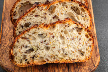 Bread cereal sunflower, chia, flax seed, cut oats fresh tasty food dish delicious gourmet food background on the table rustic food top view copy space vegetarian and vegan food