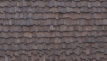Roof made of pieces of wooden planks. Background, texture with gaussian blur effect. Close-up