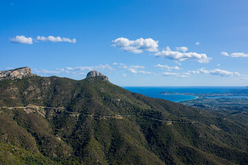 Fototapeta premium The mountain and the sea between Baunei and Dorgali in Europe, Italy, Sardinia, Baunei, in summer, on a sunny day.