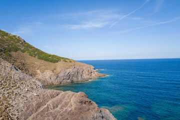 The cliffs in Argentiera in Europe, Italy, Sardinia, Argentiera, in summer, on a sunny day.
