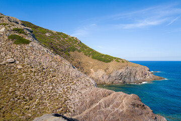 The cliffs in Argentiera in Europe, Italy, Sardinia, Argentiera, in summer, on a sunny day.