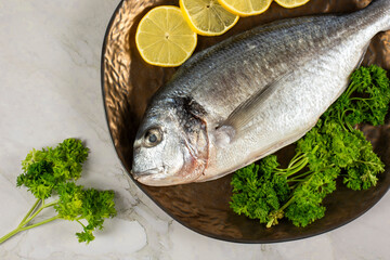 sea bream fish with lemon slices
