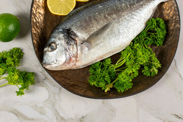 sea bream fish with lemon slices