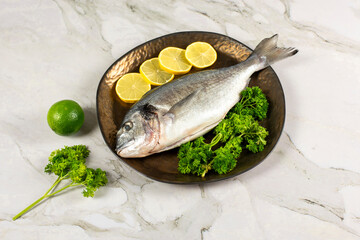 sea bream fish with lemon slices