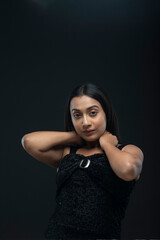 Fototapeta premium a solo female model with long black hair wearing a black skirt