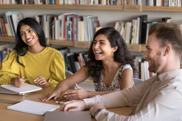 Positive study culture. Happy friendly multicultural students teammates laughing having fun on self...