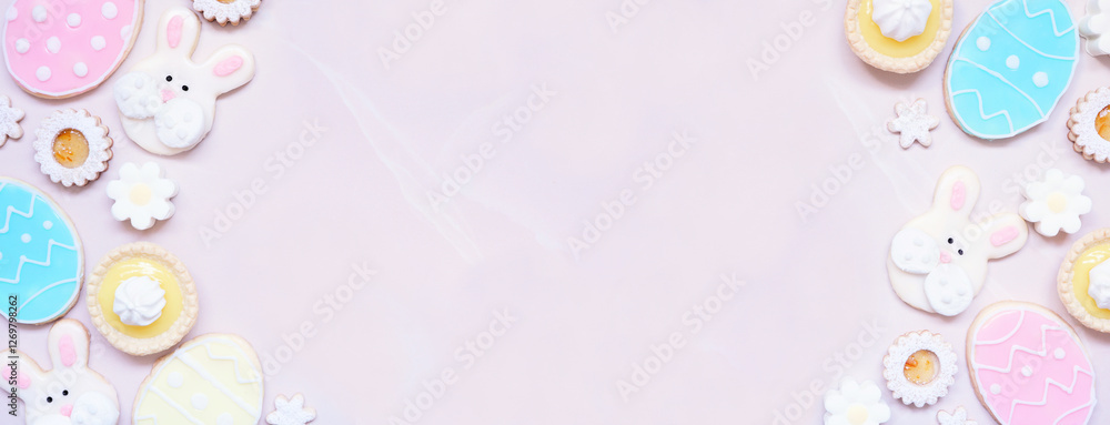 Aufkleber easter or spring themed baking double border with assorted cookies and sweet desserts. top down view