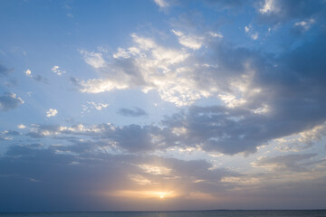 Sunset over the sea towards Oristano in Europe, Italy, Sardinia, Oristano, in summer, on a sunny day.