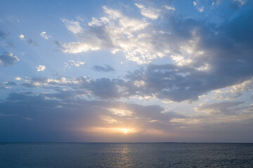 Sunset over the sea towards Oristano in Europe, Italy, Sardinia, Oristano, in summer, on a sunny...
