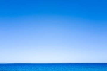 Fototapeta premium The Mediterranean Sea towards Cala Goloritze beach in Baunei in Europe, Italy, Sardinia, Baunei, in summer, on a sunny day.