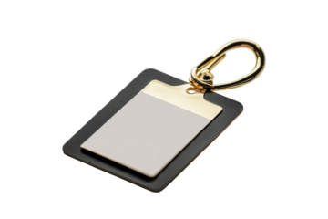 An elegant black and gold keychain tag resting on a white surface with blank identification area isolated on transparent background