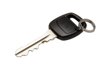 A close-up view of a modern car key resting on a white surface during daylight hours isolated on transparent background