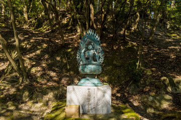 The statue on the path around the Engyoji Maniden in Himeji in Asia, Japan, Kansai, Himeji, in...