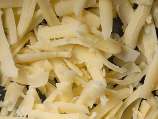 Close-up of Shredded cheddar cheese, Ready for a cheese toasty or Healthy Salad