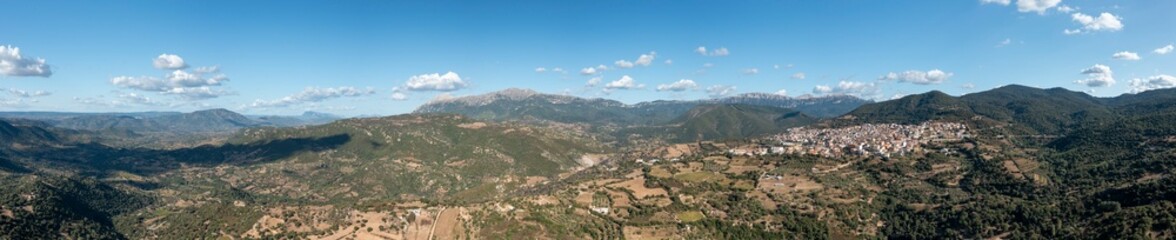 Fototapeta premium The panoramic view of the city in Orgosolo in Europe, Italy, Sardinia, Orgosolo, in summer, on a sunny day.