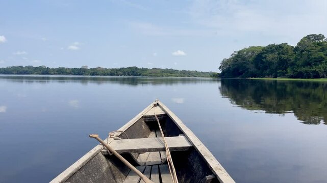 Wooden canoe on jungle lake Tarapoto, Amazon, Colombia.
