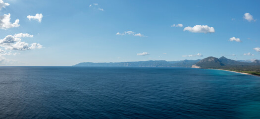 Obraz premium The panorama of the Mediterranean Sea in Orosei in Europe, Italy, Sardinia, Orosei, in summer, on a sunny day.
