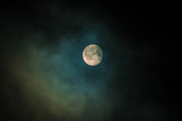 full moon over blue sky