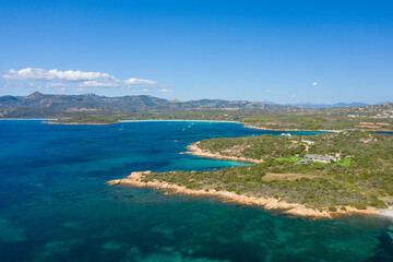 Obraz premium The Mediterranean Sea and its coast at San Teodoro in Europe, Italy, Sardinia, San Teodoro, in summer, on a sunny day.
