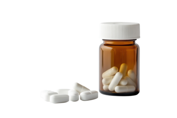 Clear and clean focus on amber bottle filled with white capsules next to scattered pills on surface isolated on transparent background