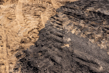 hole in the ground on the site of which a highway was started